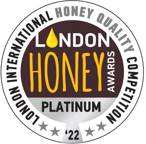 The seal of the London Honey Awards Platinum designation from 2022