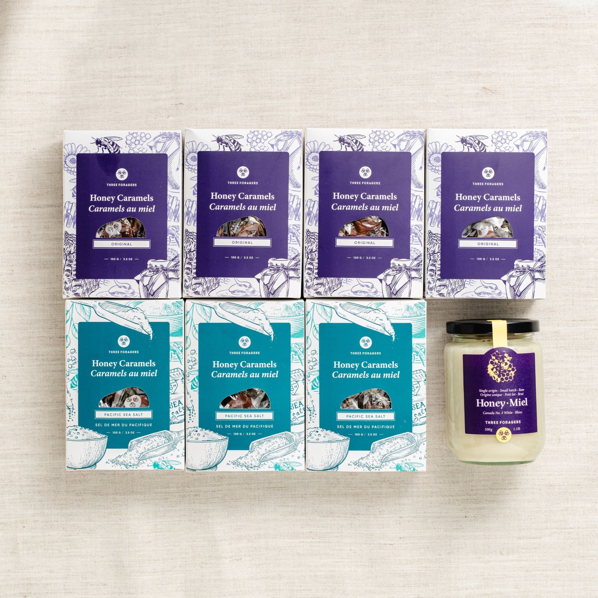 (Top row) 4 boxes of Three Foragers Original Honey Caramels
(Bottom row) 3 boxes of Three Foragers Sea Salt Honey Caramels and one jar of Three Foragers Creamed Honey
